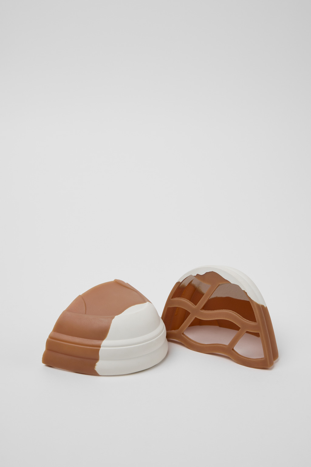 Junction Runner Toe Caps White, brown rubber toe caps.